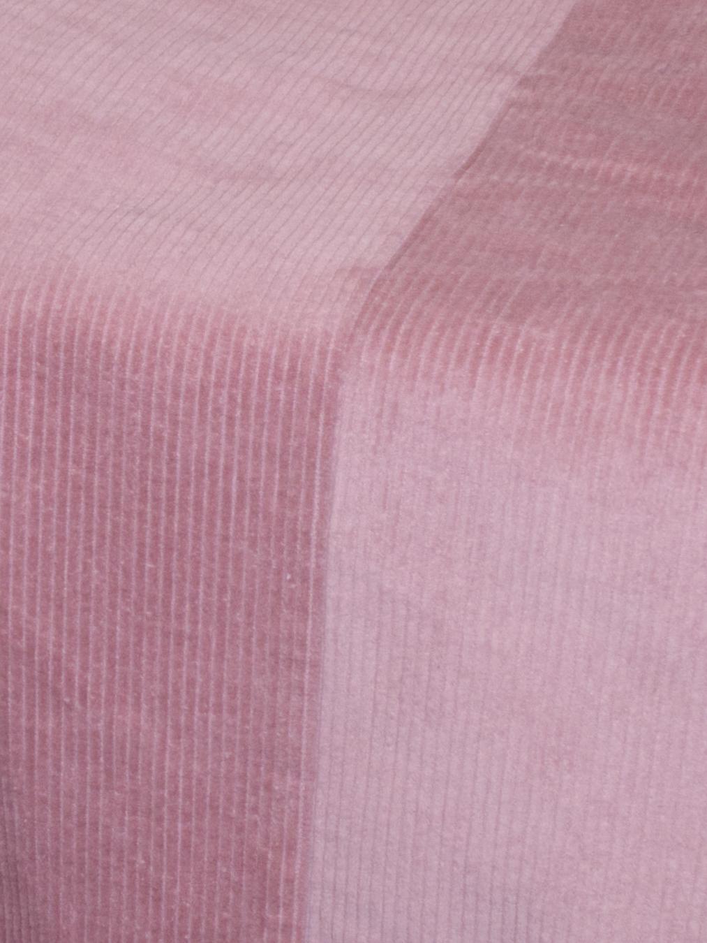 Detail view of corduroy fabric as the light hits it at various angles.